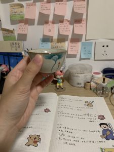 🍵 Why I Started Serenitea Tea House A calm tea moment holding a cup of Chinese tea indoors