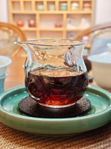 Chinese tea served in a glass pitcher on a tea tray for everyday tea drinking