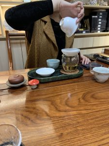 🍵 Why I Started Serenitea Tea House Tea house owner brewing Chinese tea in a traditional tea house