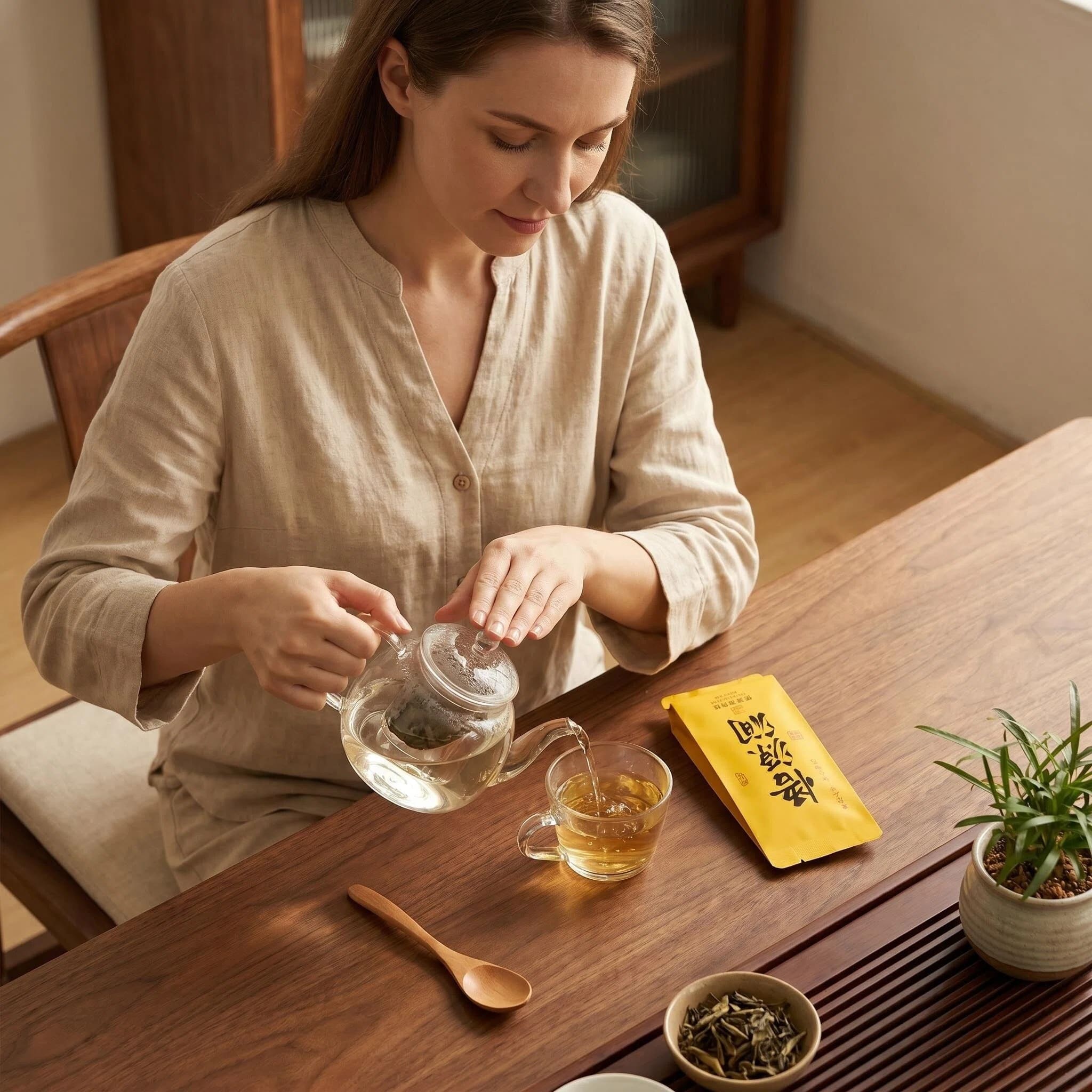 Woman Brewing Wuyi Rock Tea in a teapot A woman brewing Wuyi rock tea using a traditional teapot, capturing the mindful tea ritual.
